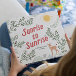 Sunrise to Sunrise NICU baby memory book cover with botanical design, smiling sun, and deer illustration